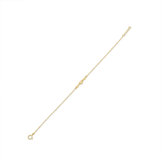 Close view of the three gold heart charms on the bracelet