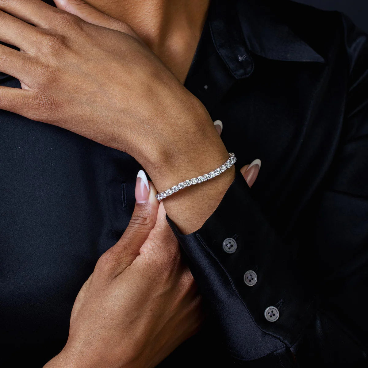 Sterling silver diamond tennis bracelet shown worn on the wrist