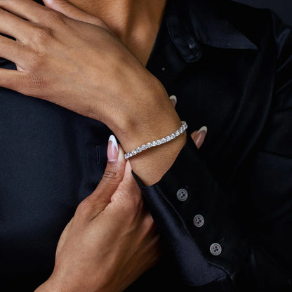 Sterling silver diamond tennis bracelet shown worn on the wrist