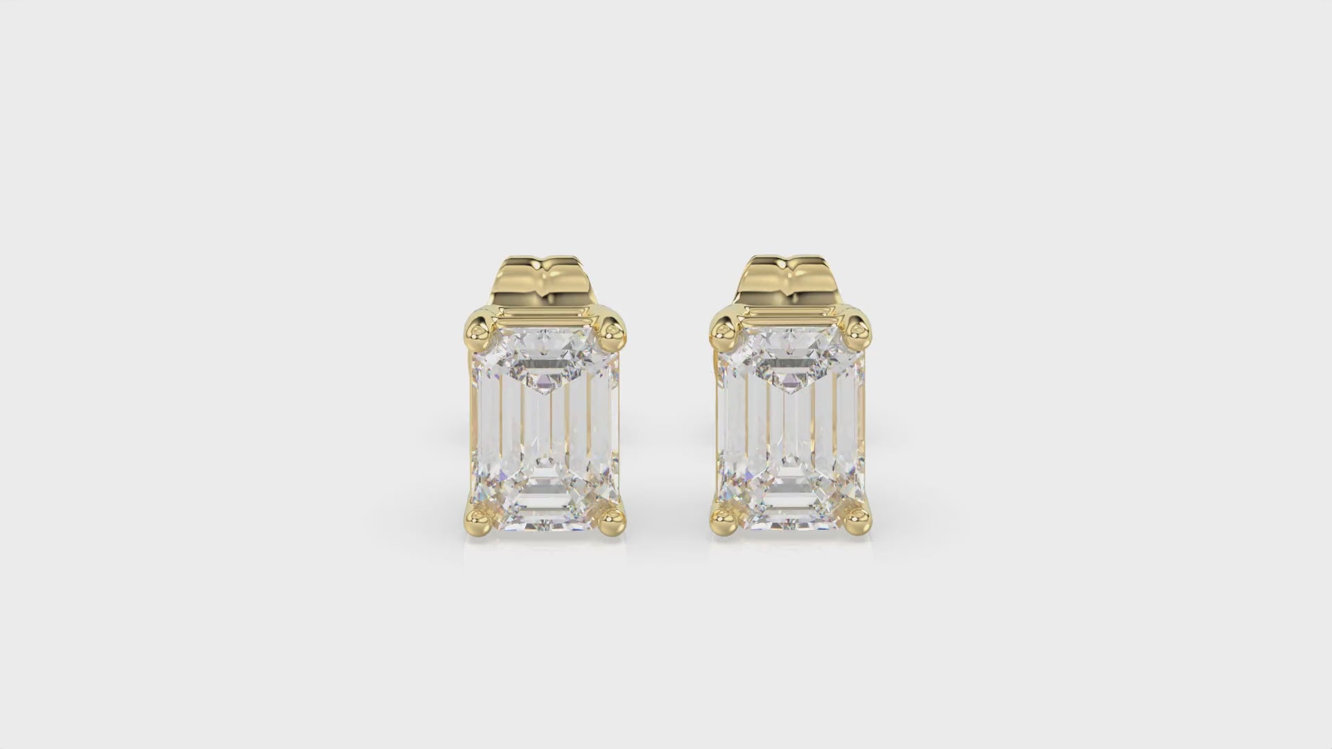 4-Prong Basket Emerald Cut Diamond Stud Earrings 1 ct, 10K Yellow Gold, video